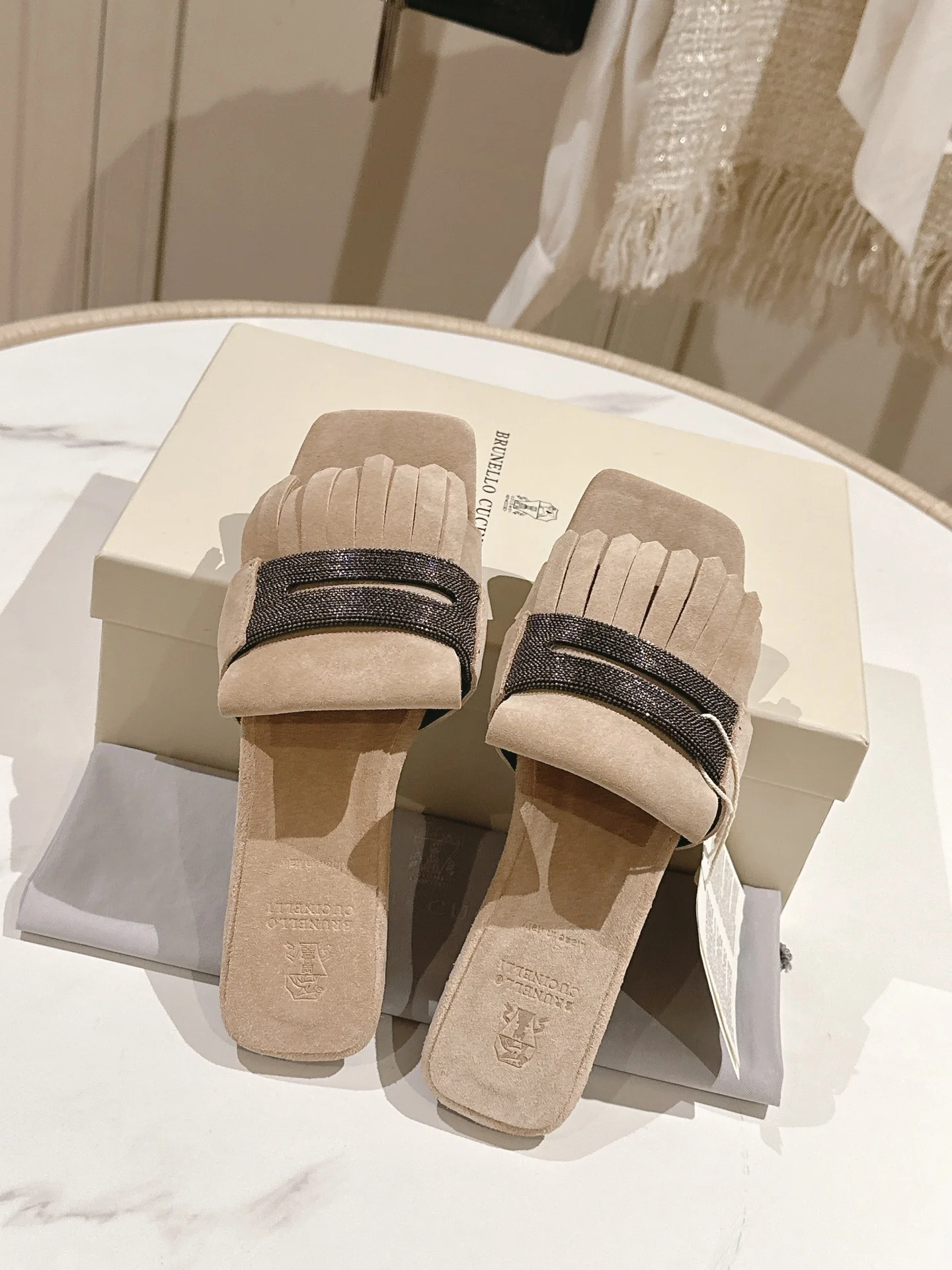 Brunello Cucinelli Suede Fringe Flat Mules with Crystal Strap – Cream Beige Edition